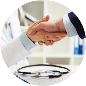 doctor shaking hands with business man